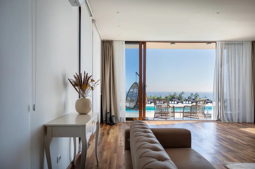 Villa Edela open-plan living room with Adriatic terrace views, Budva, Montenegro