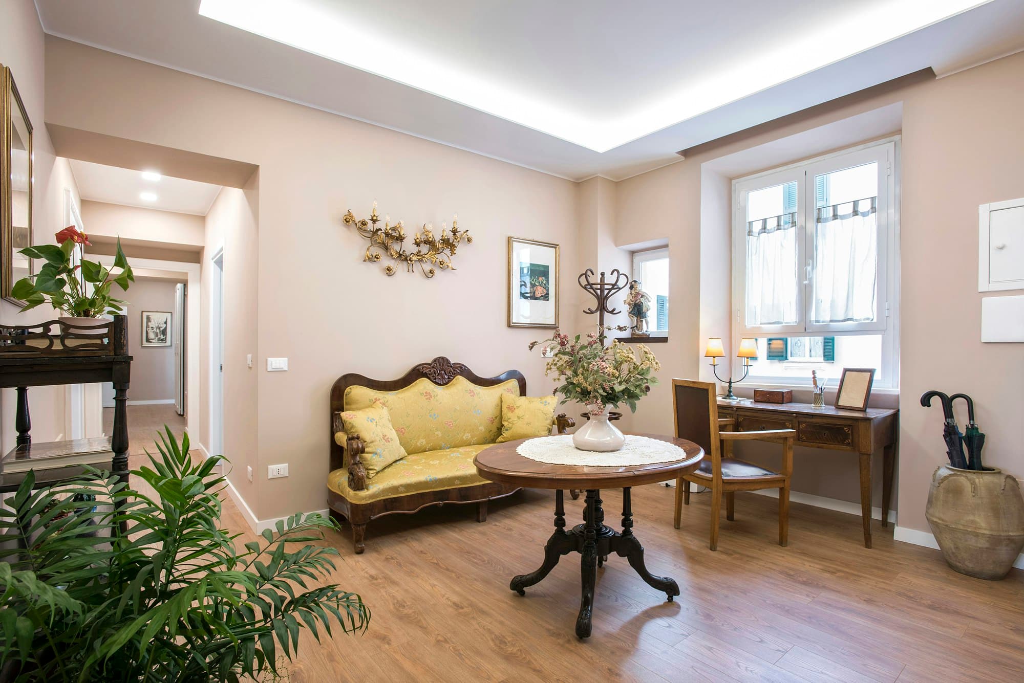 The Eternal living room with vintage yellow settee and Italian decor, Rome, Italy