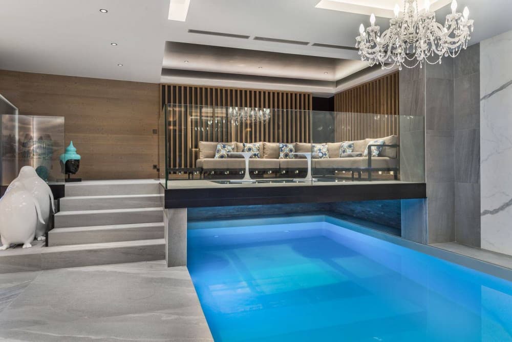 Courchevel 7 indoor pool with crystal chandelier and mezzanine lounge, Courchevel 1850, France