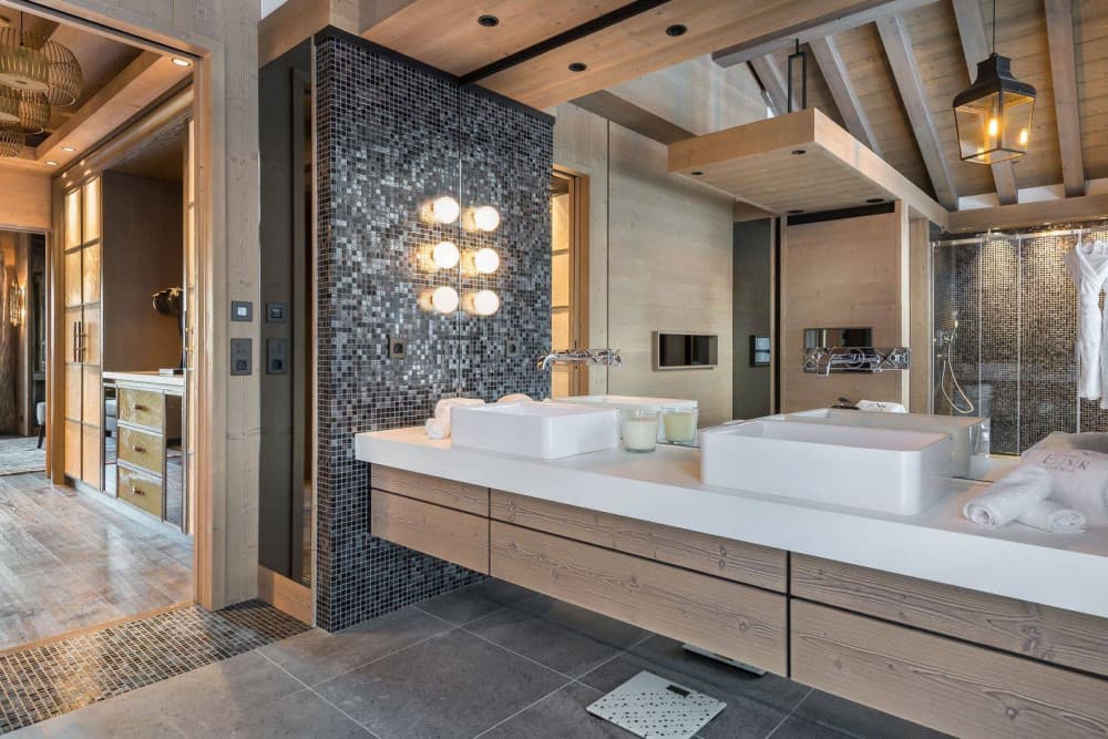 Courchevel 7 master bedroom with vaulted timber beams and Alpine balcony, Courchevel 1850, France