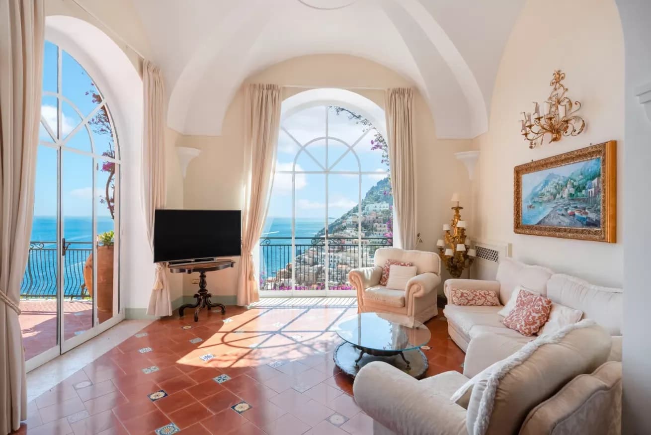 Vibrant Sunset living room with vaulted ceilings and arched windows, Positano, Amalfi Coast, Italy