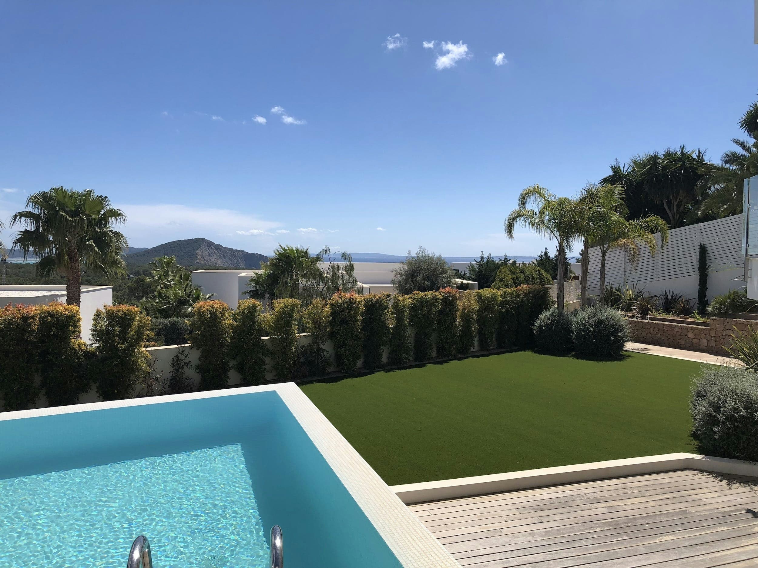 Hazy Island View infinity pool and gardens, Sant Josep de sa Talaia, Balearic Islands, Spain