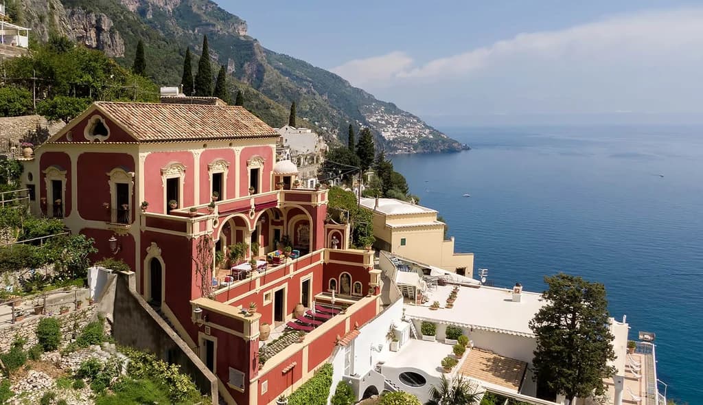 Palazzo Barocco red baroque cliffside exterior, Positano, Amalfi Coast, Italy