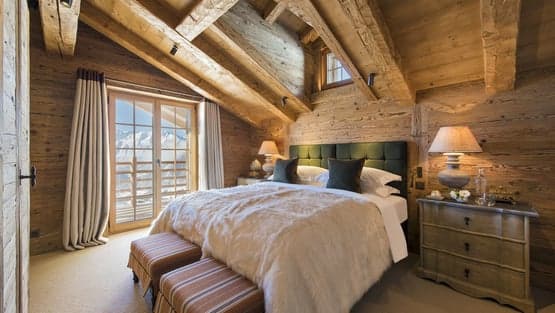 Chalet On the Top indoor pool with vaulted stone ceiling and warm lighting, Verbier, Switzerland