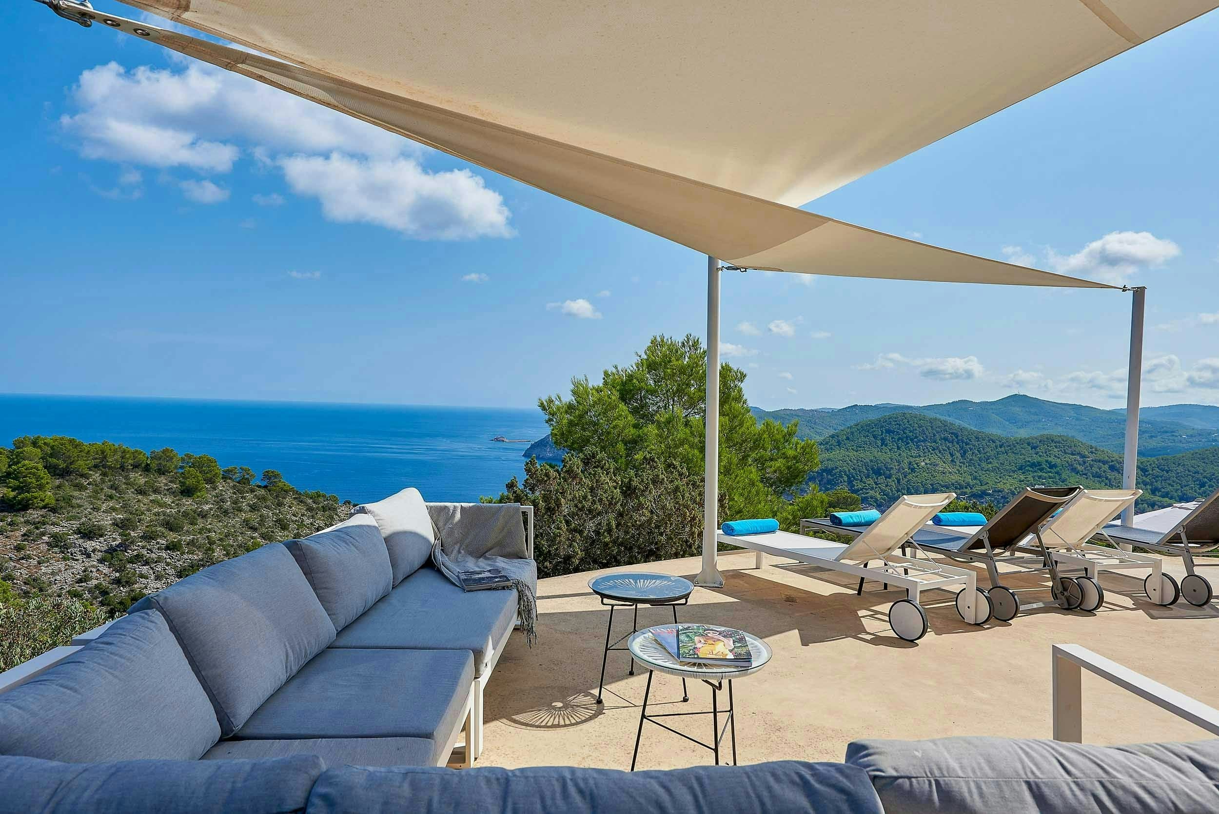 The Eyes of Benirras ocean and mountain views from terrace, Sant Joan de Labritja, Balearic Islands