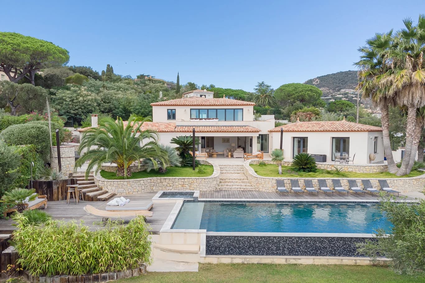 Villa Riviera exterior with infinity pool and Provençal stone terraces, Bay of St. Tropez, France