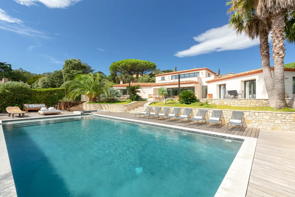 Villa Riviera lap pool with teak sun deck and stone terrace, Bay of St. Tropez, France